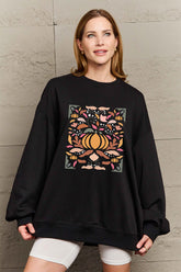 Woman wearing Graphic Dropped Shoulder Sweatshirt with colorful design, casual and stylish for everyday wear, perfect layering piece.