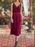 Velvet Cami Lounge Dress with lace trim, showcased in a lush, elegant setting, perfect for a chic and comfortable evening.