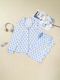 Bow Print Pajama Set by Felvior with long sleeve shirt and pants, featuring a blue bow pattern, laid flat with accessories.