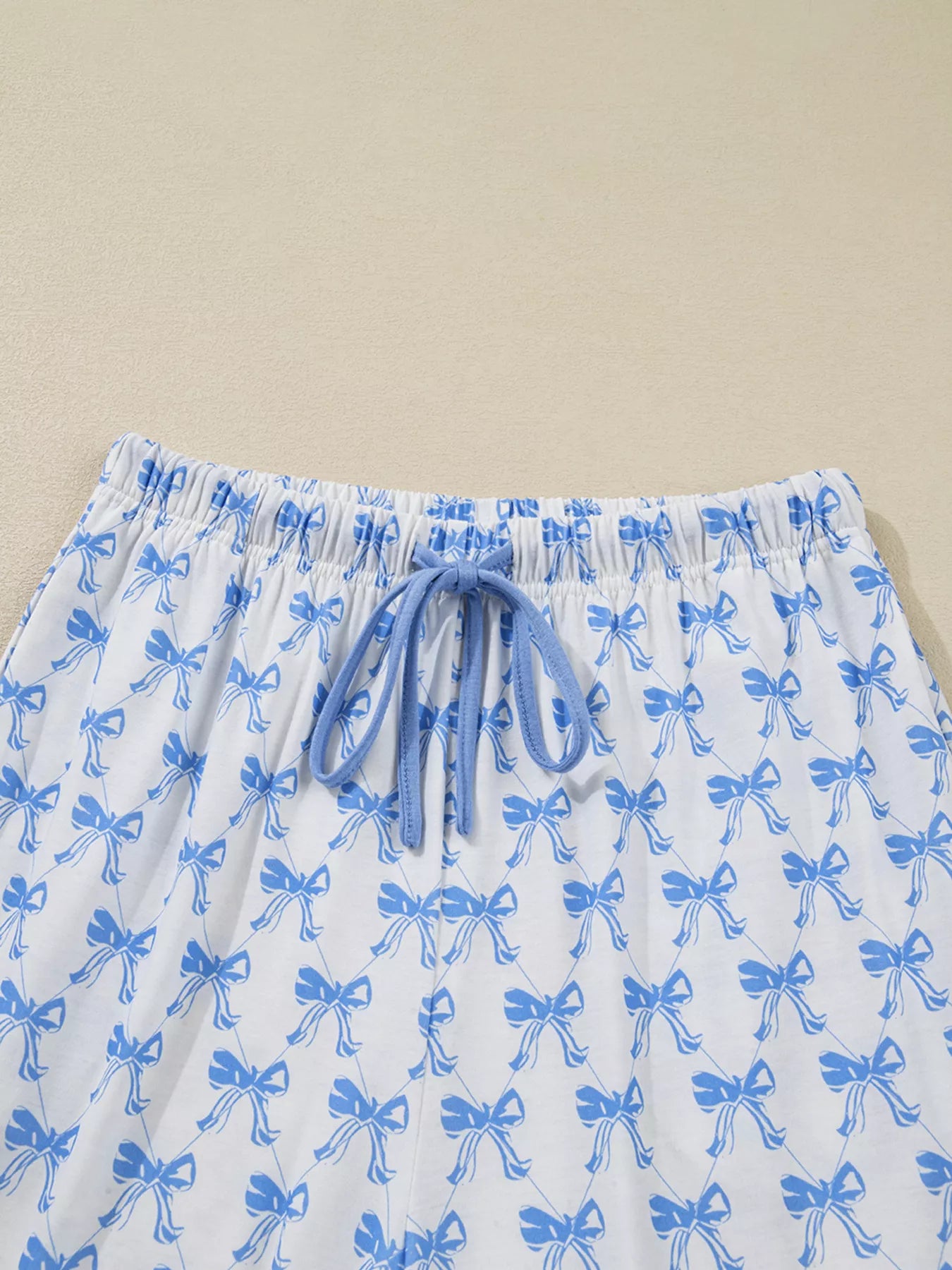 Bow Print Pajama Set pants with blue bows and drawstring waist by Felvior.