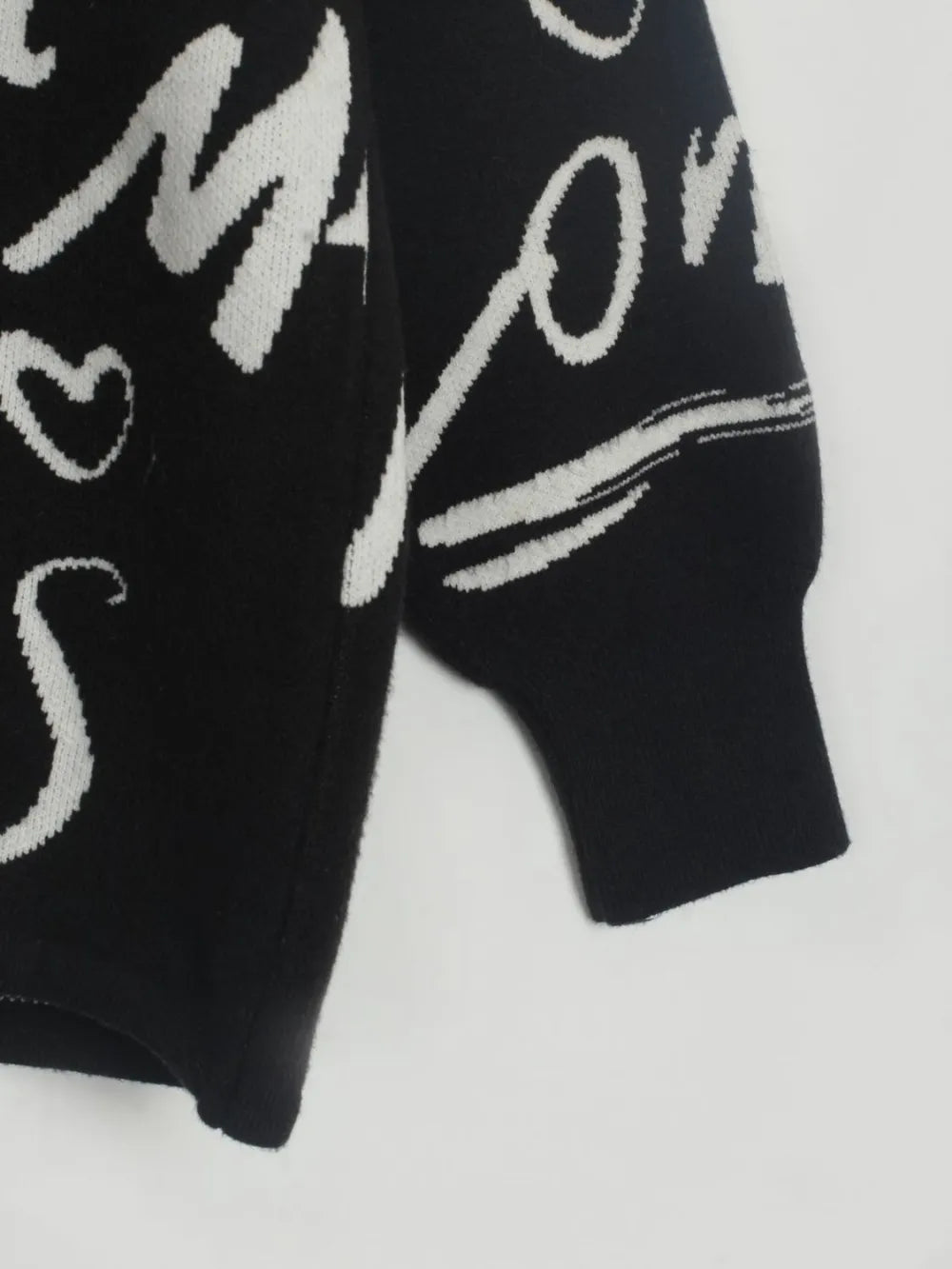 Letter Pattern Sweater with bold letter design, featuring drawstring hem and dropped shoulder for modern style and comfort.