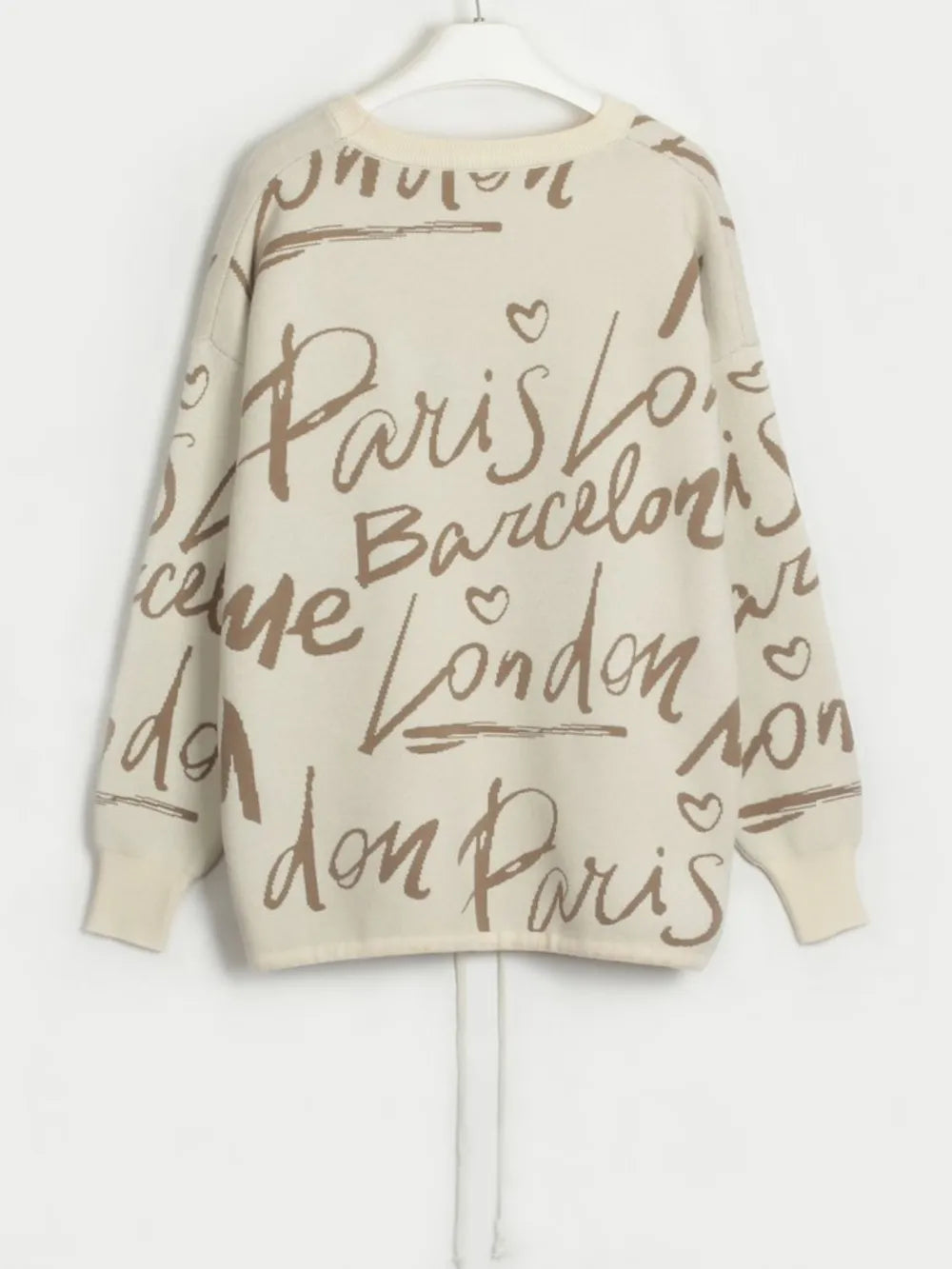 Letter Pattern Sweater with drawstring hem and dropped shoulder in beige, featuring city names in script.
