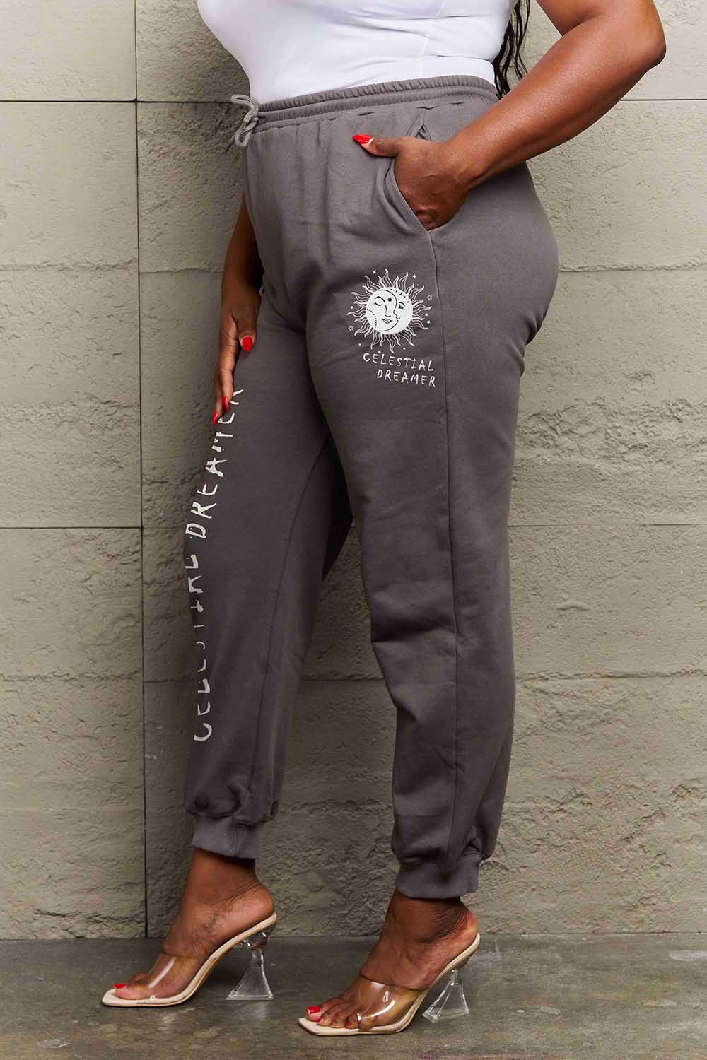 Graphic Sweatpants with CELESTIAL DREAMER print, featuring soft cotton-poly blend and drawstring waistband.