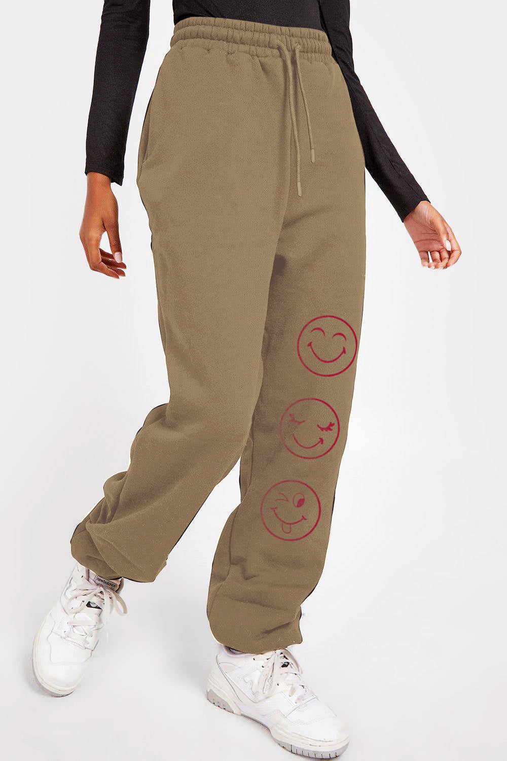 Graphic Sweatpants with emoji print, featuring adjustable drawstring waist, shown on model for casual fashion.