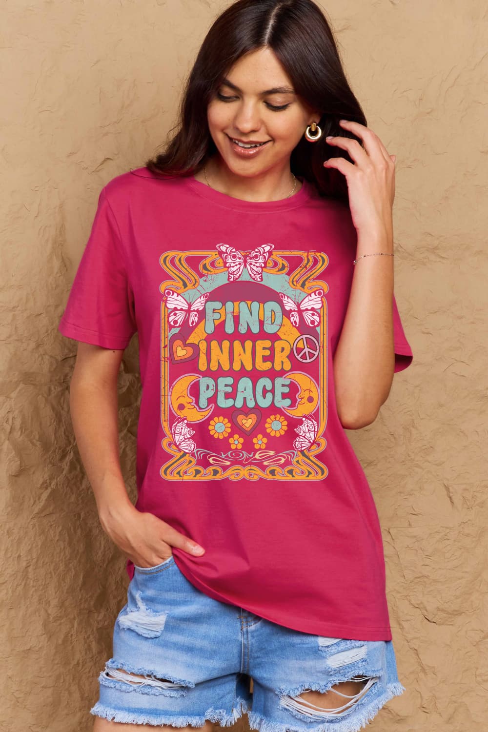Woman wearing Graphic Cotton T-Shirt with 'FIND INNER PEACE' print, showcasing full-size fit and casual style.