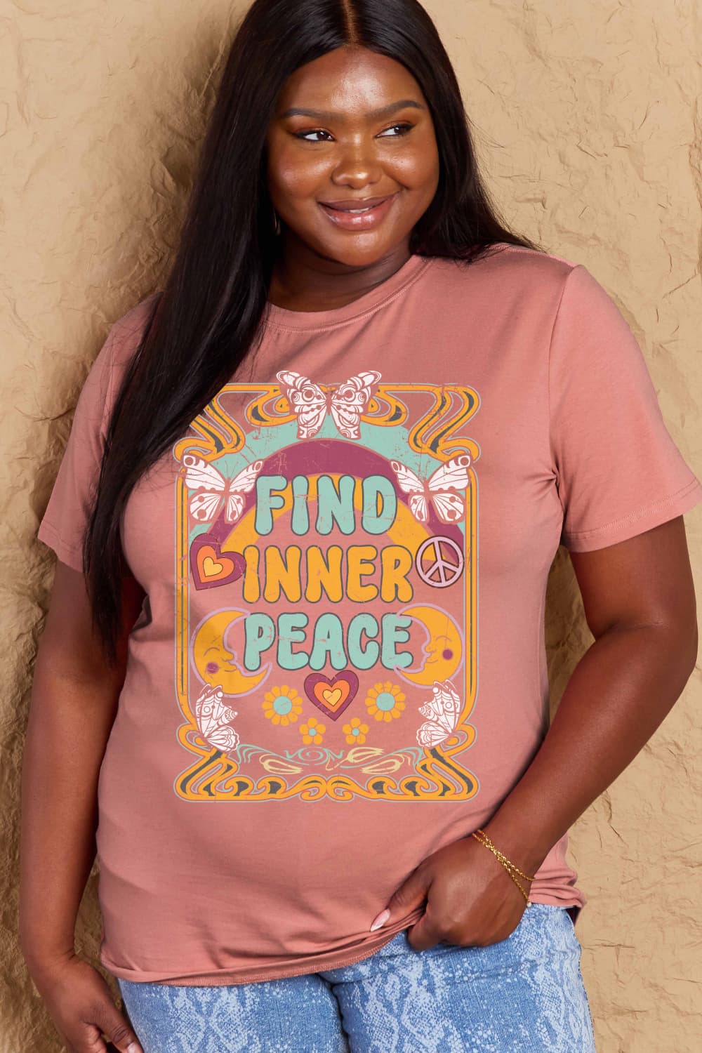 Model wearing Graphic Cotton T-Shirt with FIND INNER PEACE print, showcasing comfort and style.