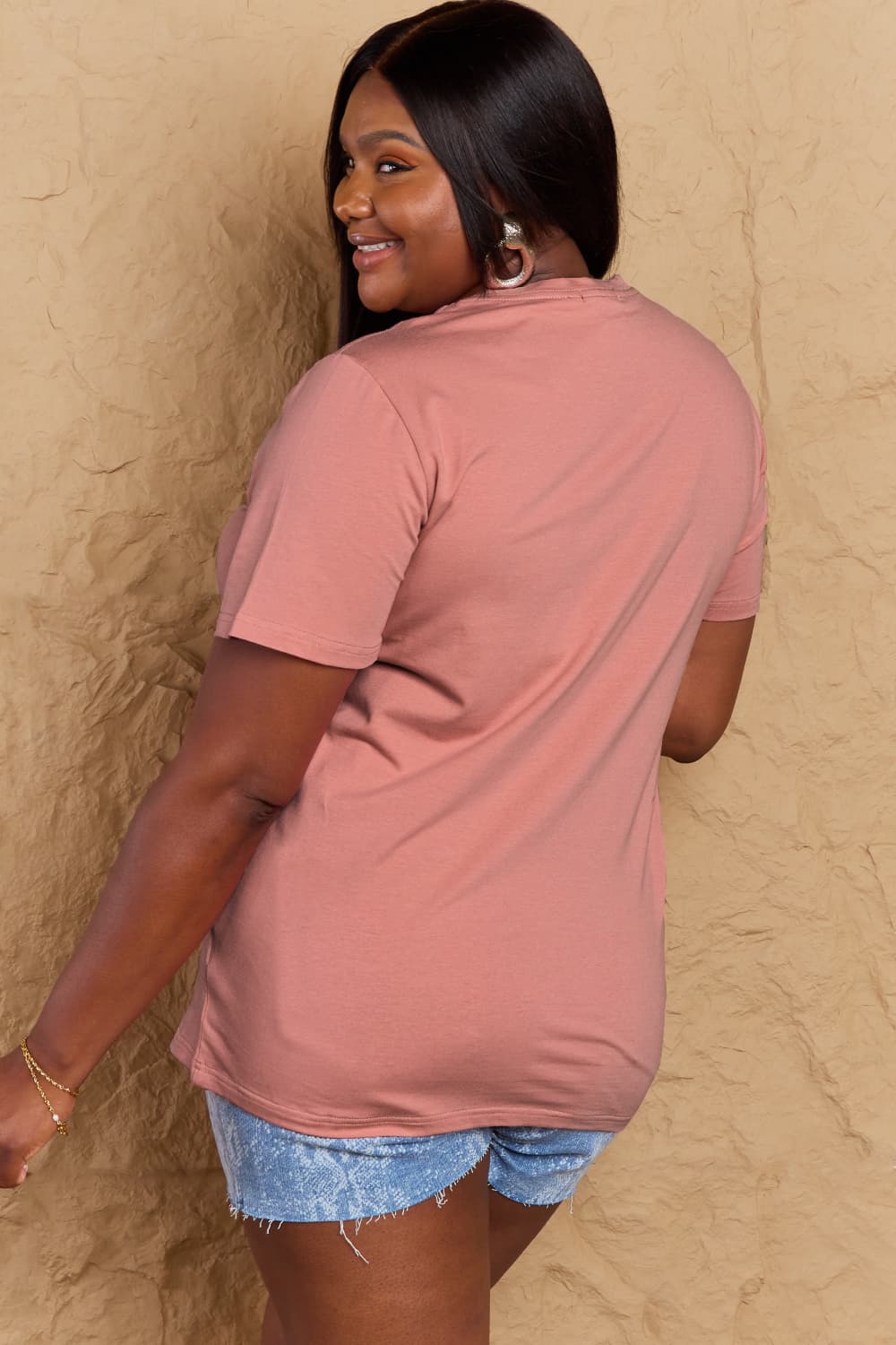 Back view of model wearing Graphic Cotton T-Shirt with FIND INNER PEACE print, showcasing comfortable style and full-size fit.