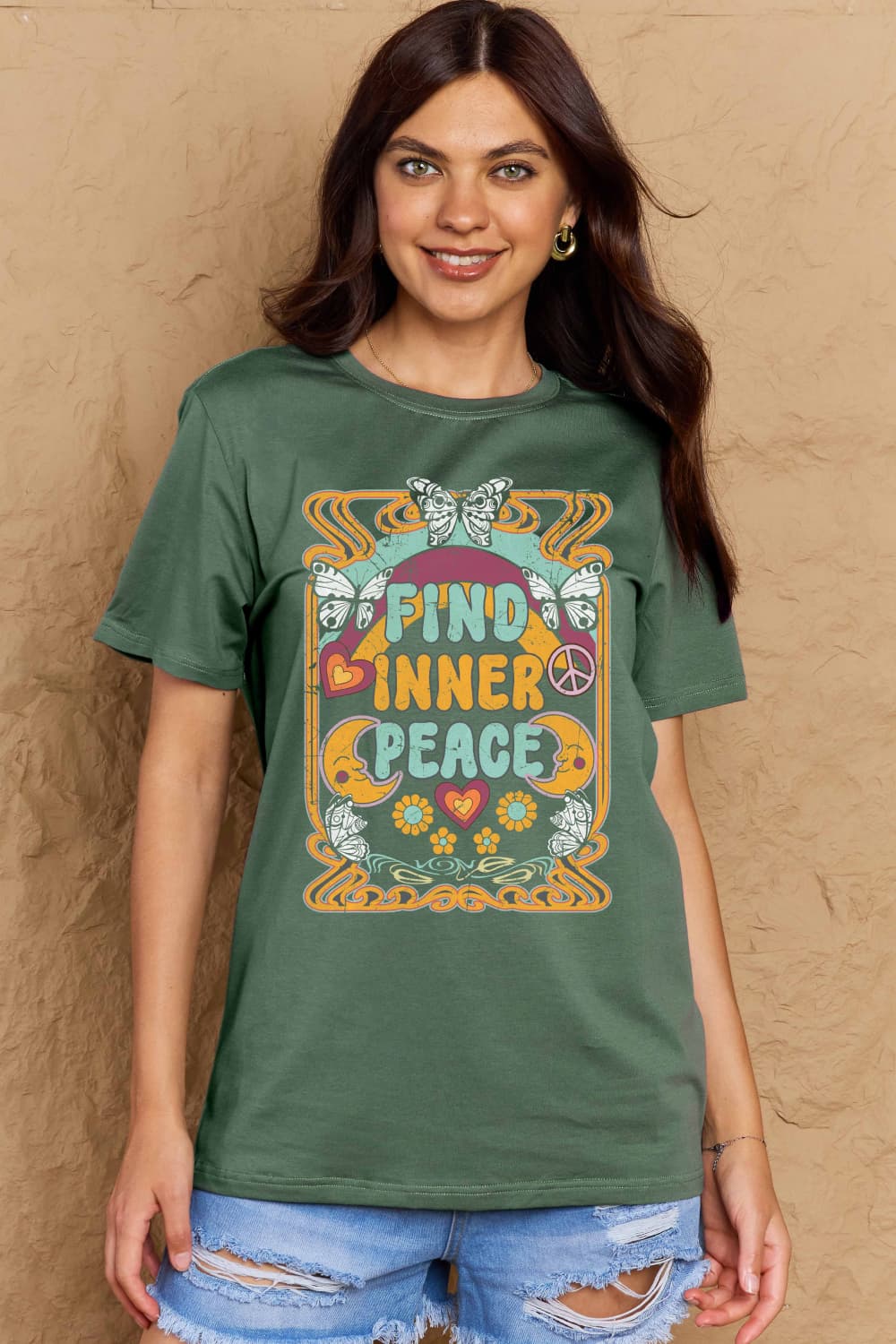 Model wearing Graphic Cotton T-Shirt with 'FIND INNER PEACE' print, featuring a casual design for comfort and style.