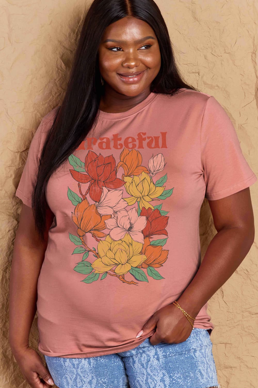 Woman wearing Graphic Cotton T-Shirt with GRATEFUL flower print design