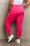 Full-size bright pink Graphic Sweatpants with drawstring waistband, perfect for casual comfort and style.