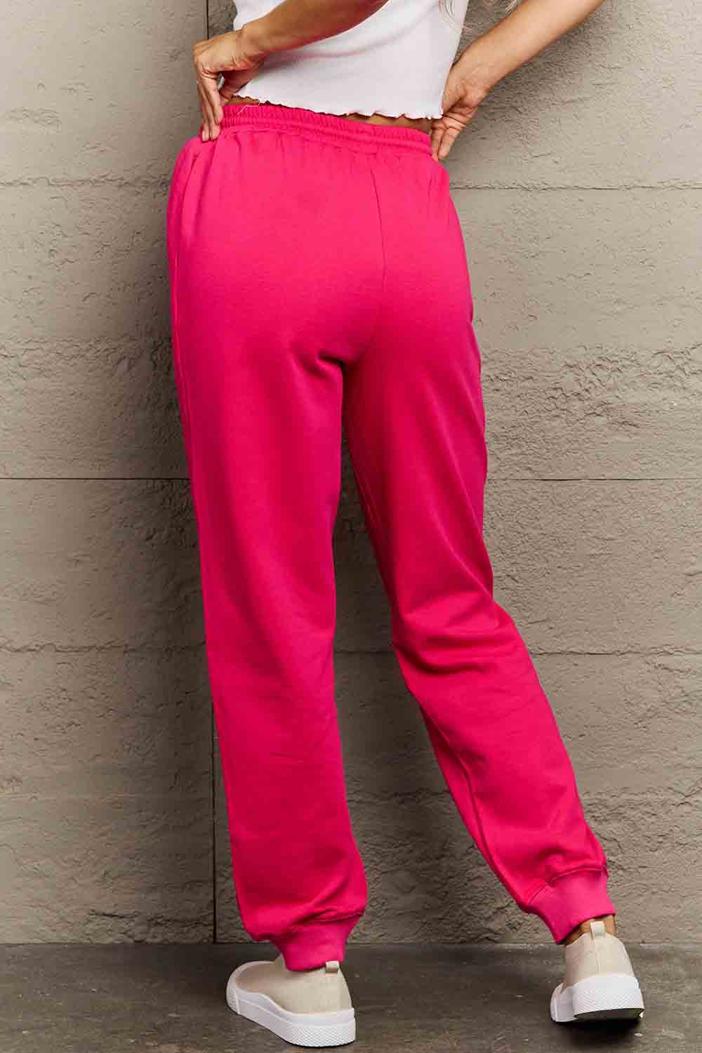 Graphic Sweatpants with PINK print, full-size, featuring a drawstring waistband made from soft cotton-poly blend for comfort and style.