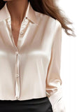 Woman wearing Button Down Long Sleeve Shirt, collared neck, perfect for work or casual occasions.