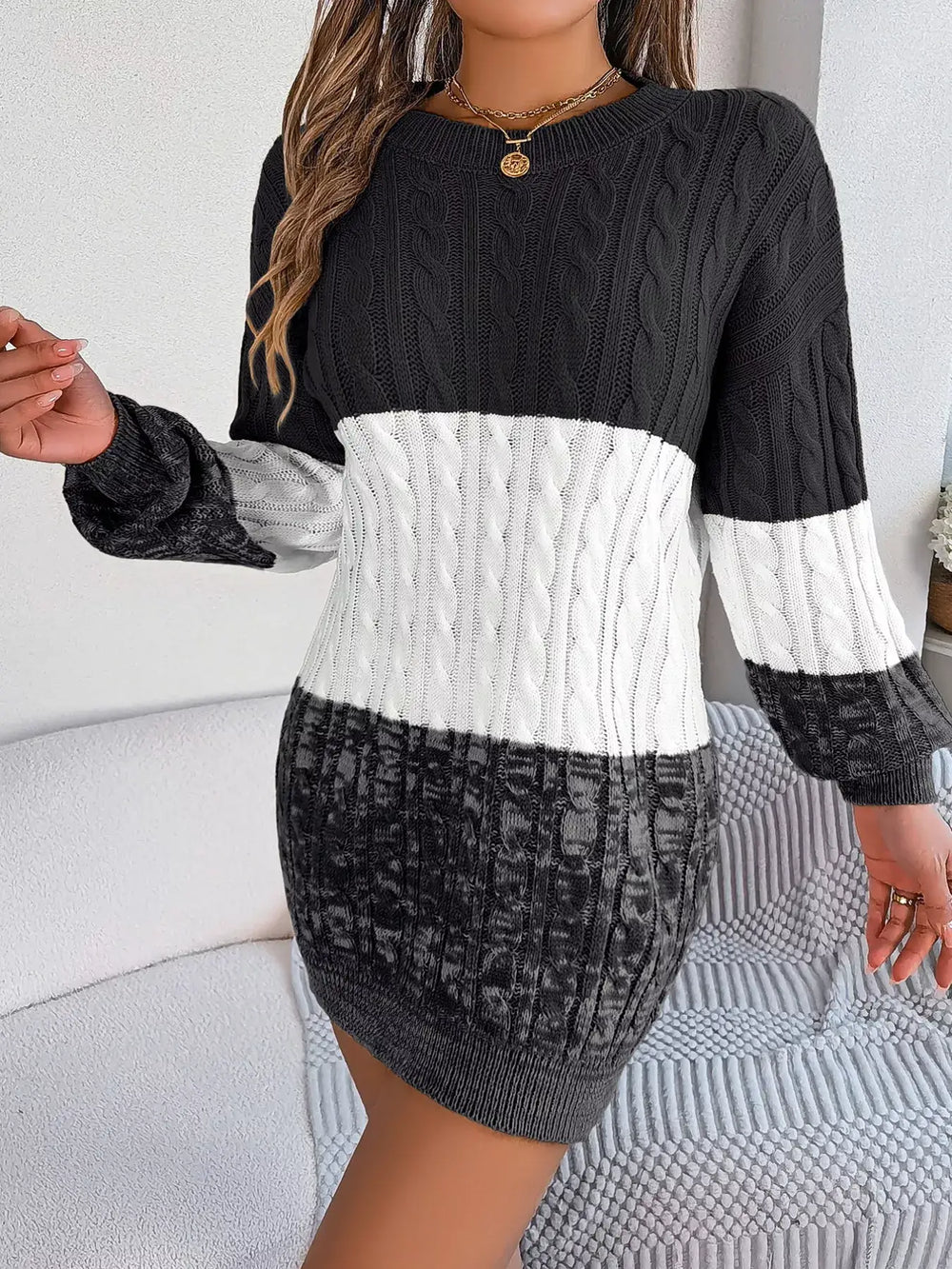 Color block cable knit sweater dress with textured pattern, featuring basic style and slightly stretchy fit, made of 100% acrylic.